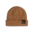 Brown ribbed knit beanie with a black Tribute logo patch.